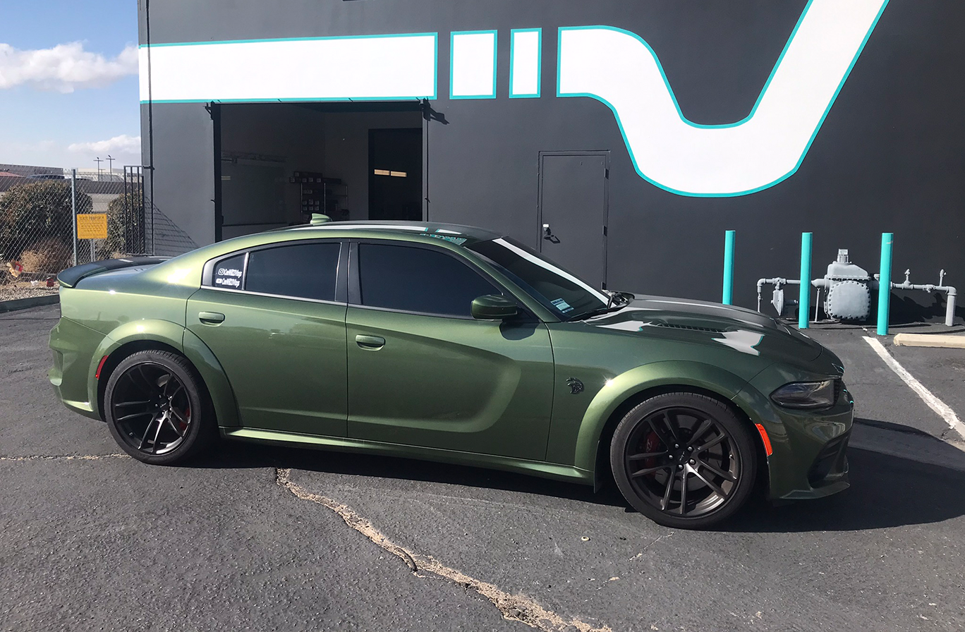 Green sports car parked outside
