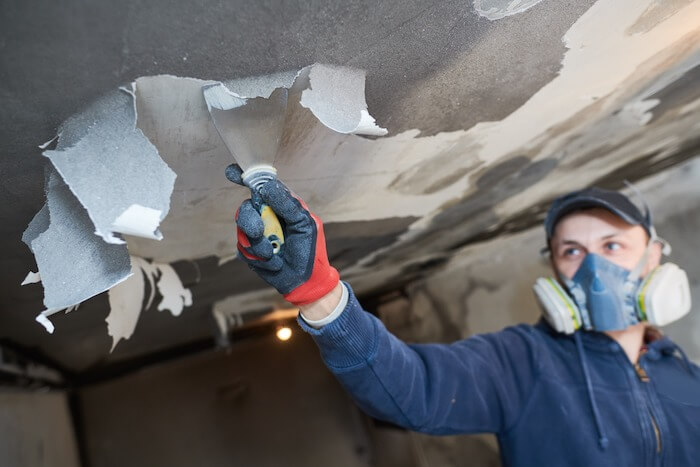 Ceiling demolition renovation services worker